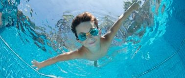 Recreational Water| Child underwater in a swimming pool